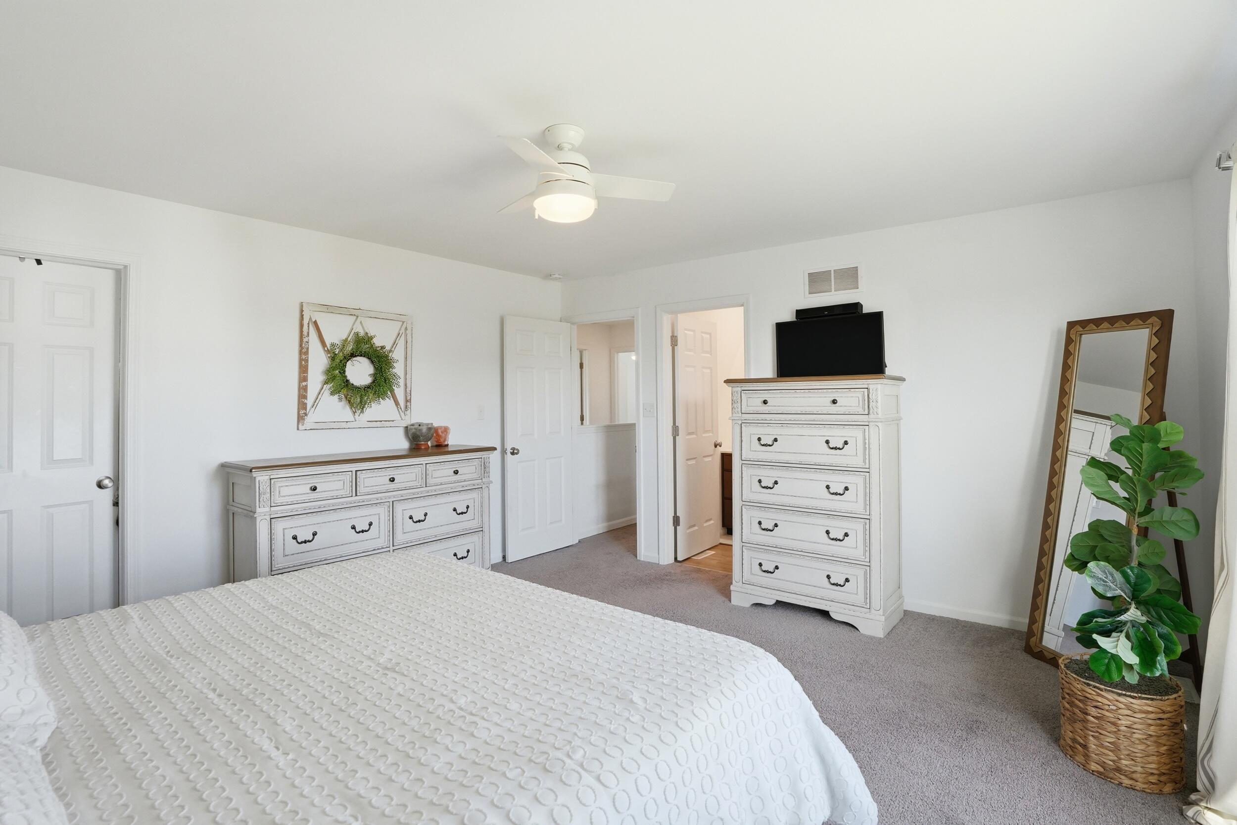 8658 Valley Forge Way Lowell, IN 46356 - Photo 13 of 23 a bedroom with a bed and a dresser