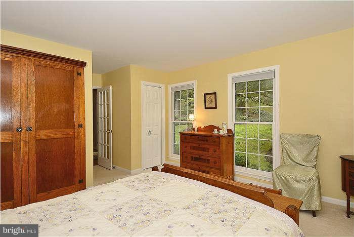 24 Elmridge Road Arnold, MD 21012 - Photo 14 of 30 a bedroom with a bed and wooden floor