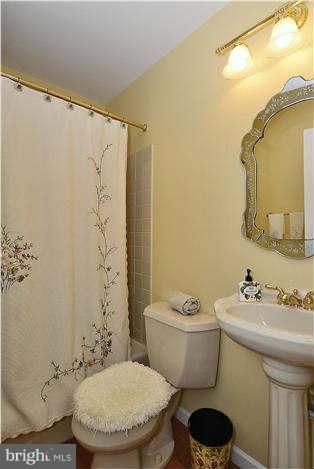 24 Elmridge Road Arnold, MD 21012 - Photo 15 of 30 a bathroom with a sink and a mirror