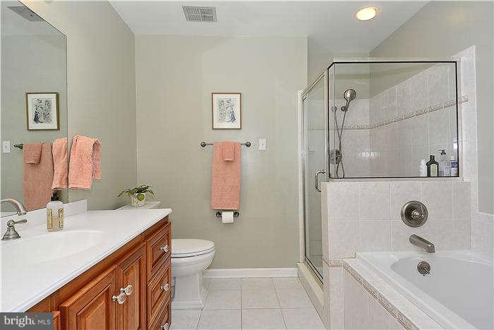 24 Elmridge Road Arnold, MD 21012 - Photo 17 of 30 a bathroom with a sink a toilet and shower