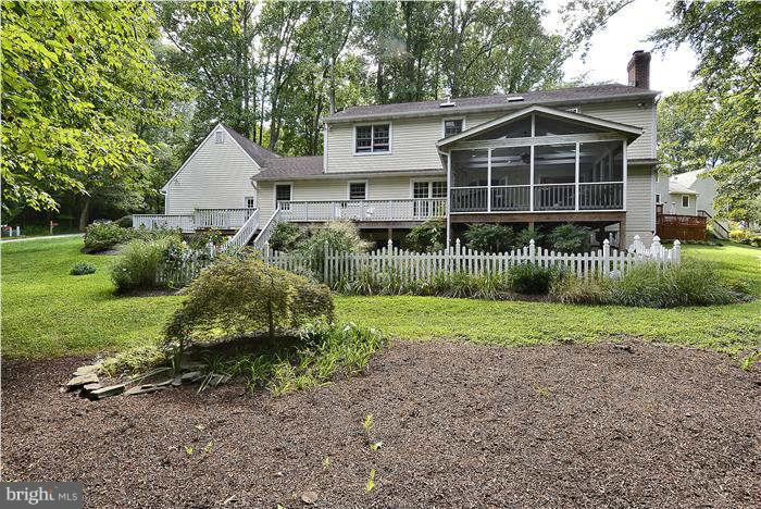 24 Elmridge Road Arnold, MD 21012 - Photo 24 of 30 a front view of a house with a yard and garage