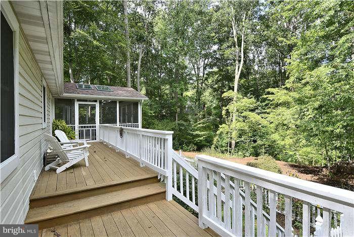 24 Elmridge Road Arnold, MD 21012 - Photo 25 of 30 a view of house with a deck and furniture