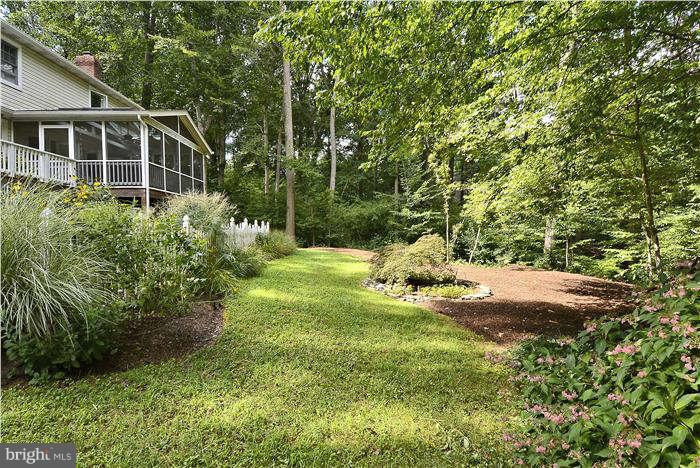 24 Elmridge Road Arnold, MD 21012 - Photo 26 of 30 a view of a house with a yard and plants