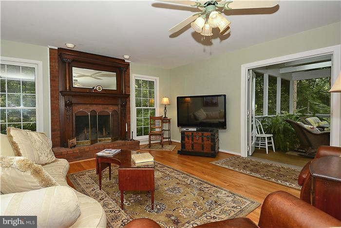 24 Elmridge Road Arnold, MD 21012 - Photo 5 of 30 a living room with furniture and a flat screen tv