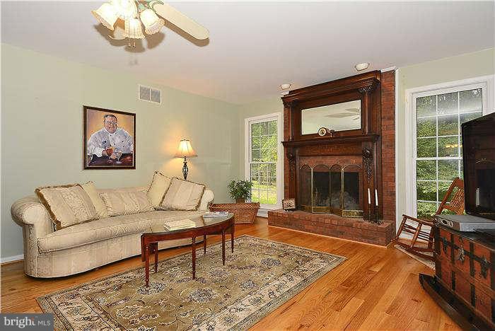 24 Elmridge Road Arnold, MD 21012 - Photo 6 of 30 a living room with furniture a window and a fireplace