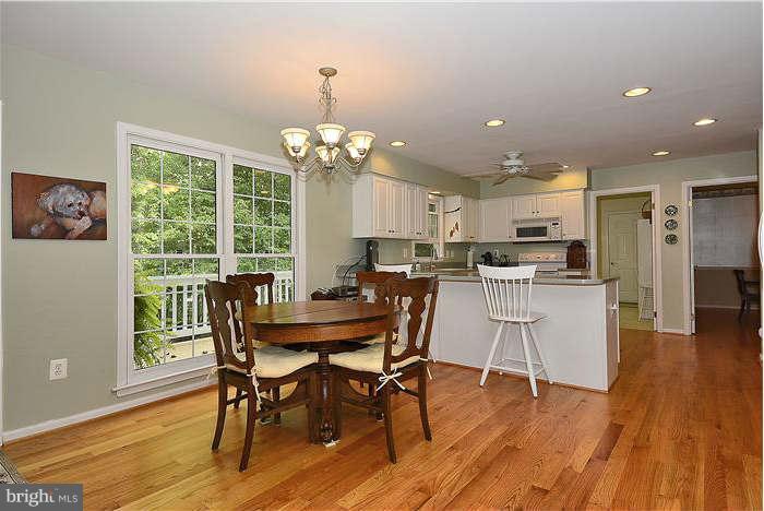 24 Elmridge Road Arnold, MD 21012 - Photo 7 of 30 a view of a dining room with furniture wooden floor and chandelier