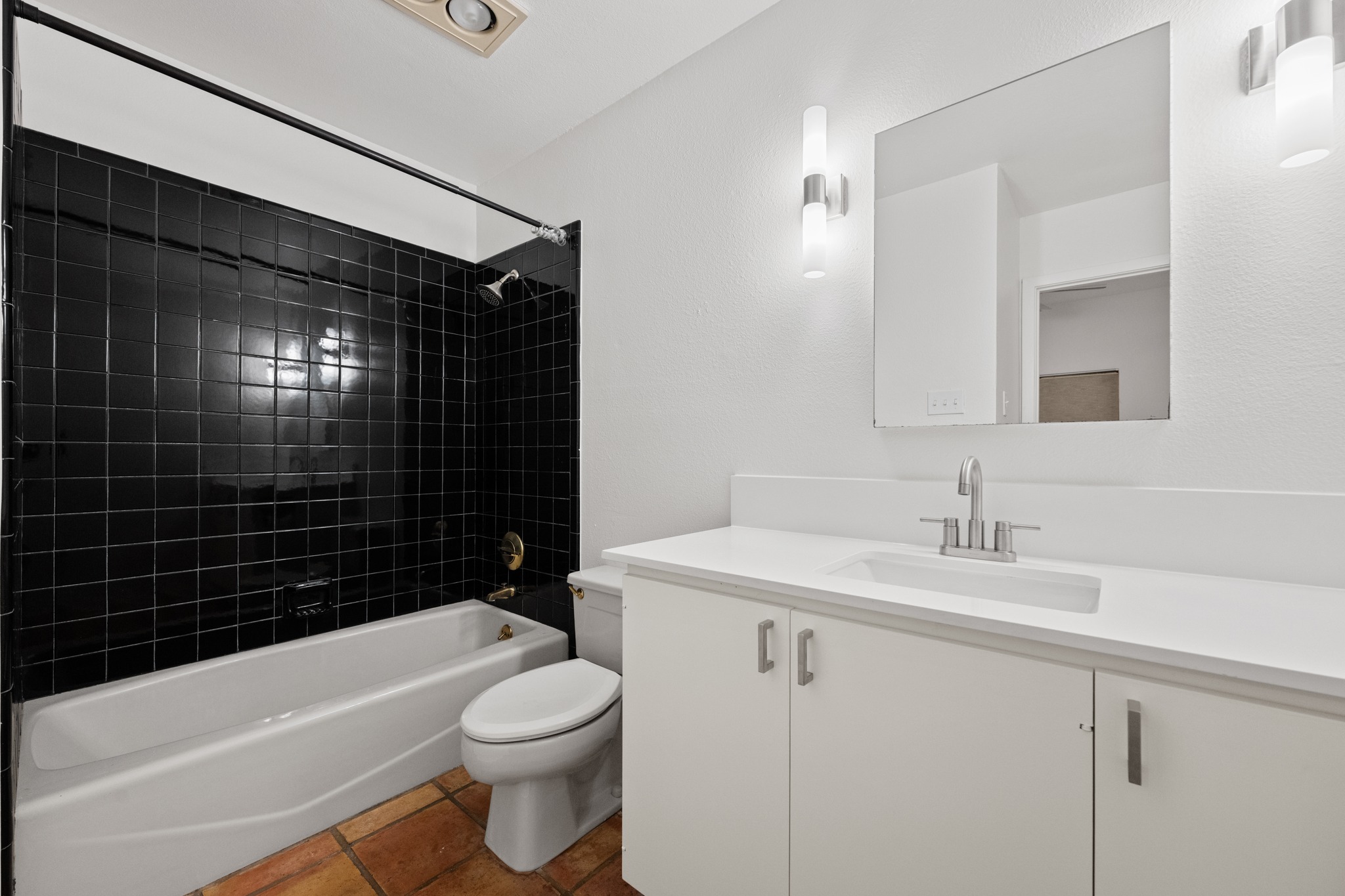 409 East 38th Street, Unit 101 Austin, TX 78705 - Photo 19 of 27 Second bathroom featuring new counters, sink, faucets and light fixtures.