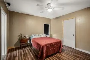 a bedroom with a bed and a chandelier