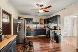 3544 Heathville-Ohl Road Summerville, PA 15864 - Photo 6 of 16 a kitchen with stainless steel appliances kitchen island granite countertop a refrigerator a sink a stove and dishwasher with wooden floor