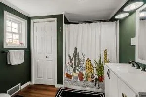 a view of a bathroom with a sink and a mirror