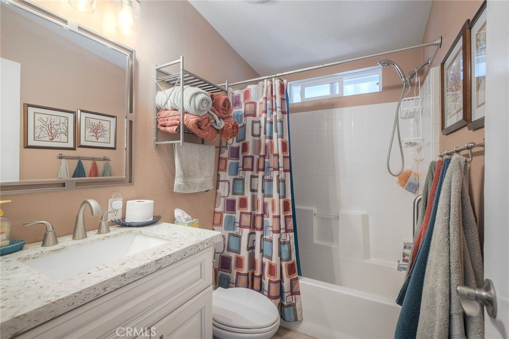 3909 Reche Road, Unit 125 Fallbrook, CA 92028 - Photo 19 of 58 a bathroom with a granite countertop sink toilet and shower