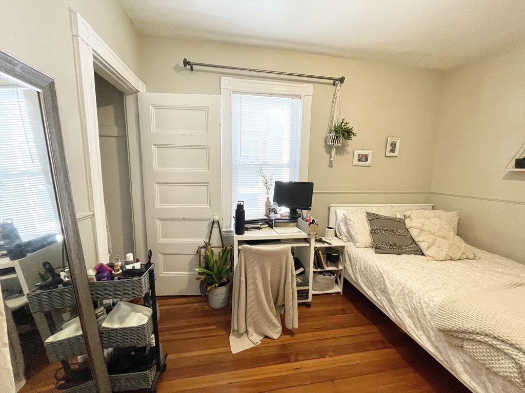 9 Taft Street, Unit 1 Boston, MA 02125 - Photo 7 of 15 a living room with a bed furniture and a window