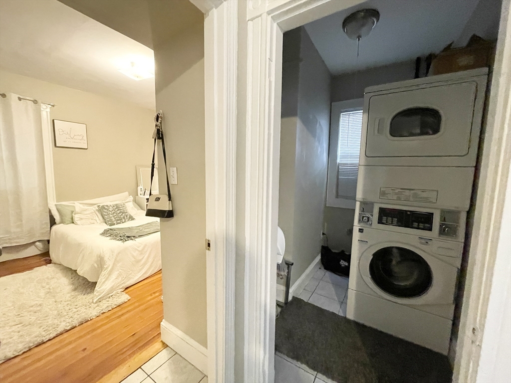 9 Taft Street, Unit 1 Boston, MA 02125 - Photo 9 of 15 a view of a livingroom with furniture and washer