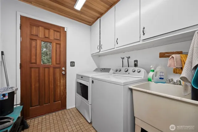 a utility room with dryer and washer