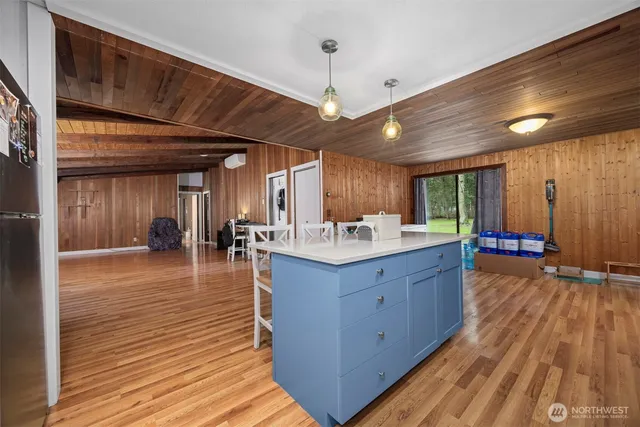 a large hall with wooden floor and a large space