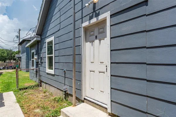 a kitchen with granite countertop a stove top oven and sink