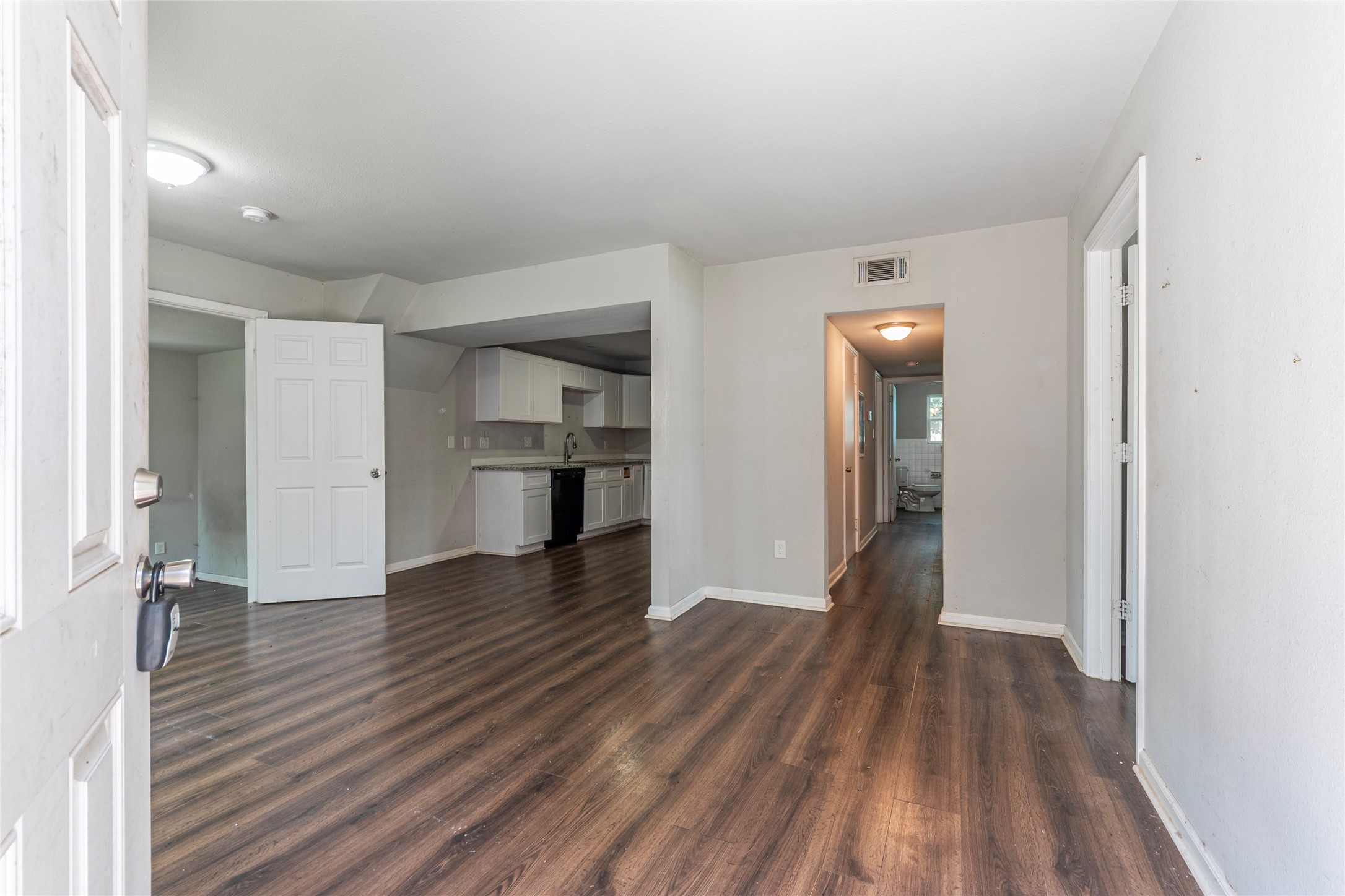 2801 Virginia Street, Unit B Baytown, TX 77520 - Photo 3 of 20 a view of empty room with wooden floor