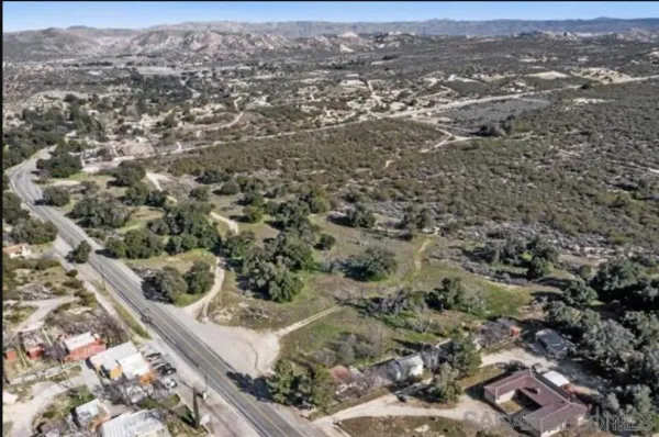 an aerial view of residential house with parking space
