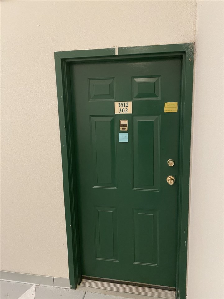 3512 Ivy Commons Drive, Unit 302 Raleigh, NC 27606 - Photo 4 of 4 a green door in front of a door