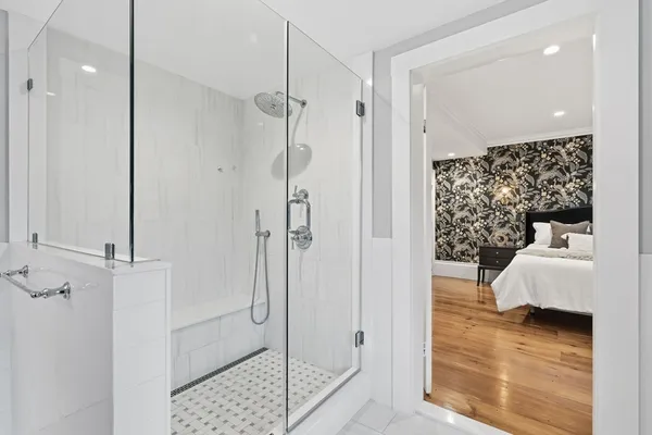 a spacious bedroom with a bed and a window