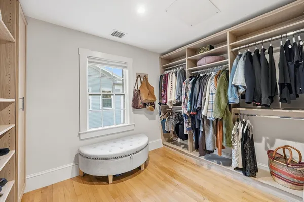 a bedroom with a bed and a mirror