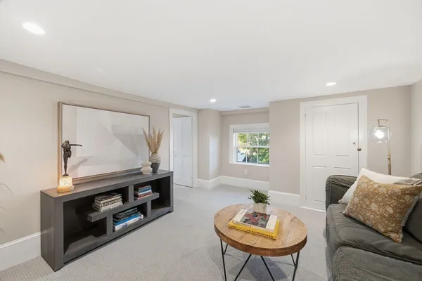 a bed room with a bed and potted plants with wooden floor