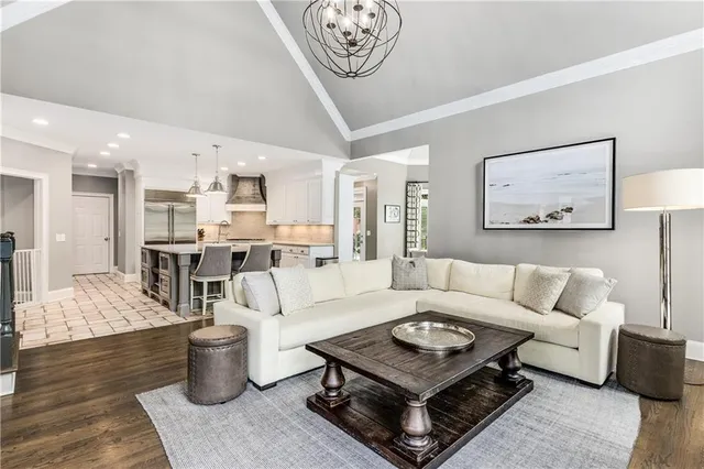 a kitchen with stainless steel appliances kitchen island granite countertop a sink and cabinets