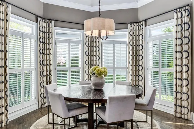 a bedroom with a bed and a ceiling fan