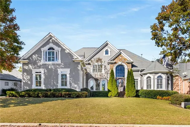 a front view of a house with a yard