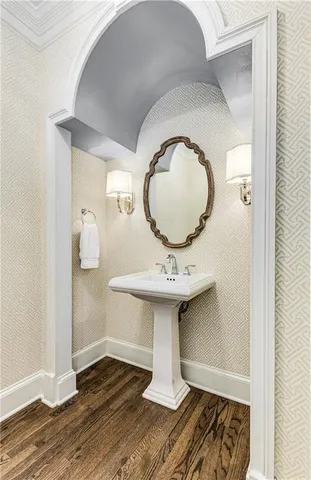 a kitchen with stainless steel appliances granite countertop a sink a stove and cabinets