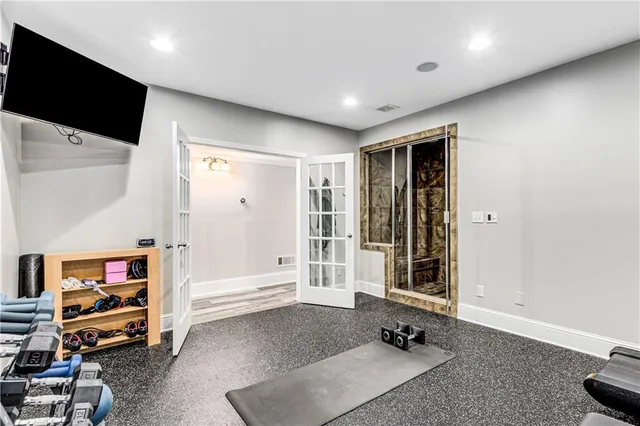 a living room with furniture window and a flat screen tv