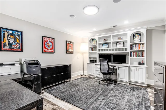 a view of a big house with a big yard and potted plants
