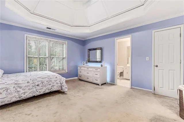 an aerial view of residential houses with outdoor space and trees