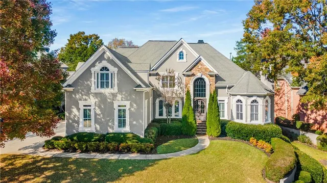 an aerial view of a house with a garden