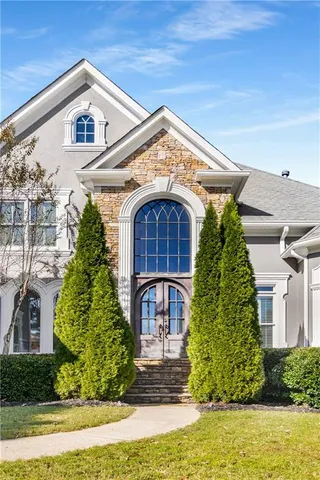 an aerial view of a house with a big yard