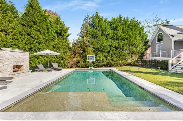a view of a swimming pool with chairs