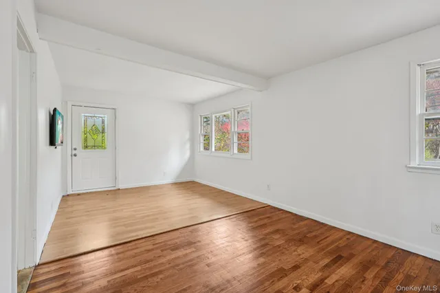 a view of an empty room and window