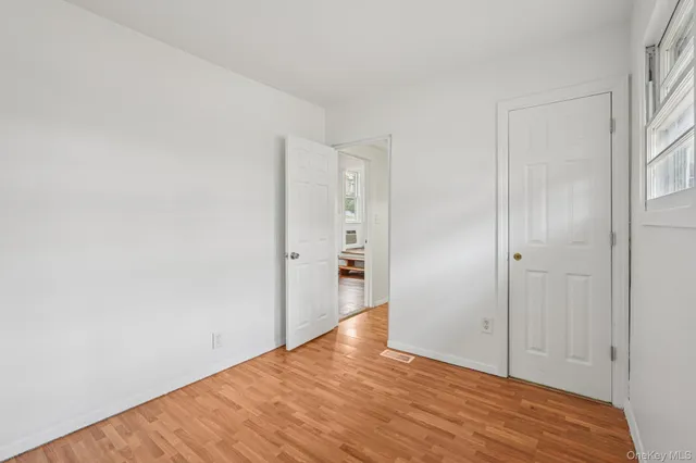 a view of a hallway with washer and dryer