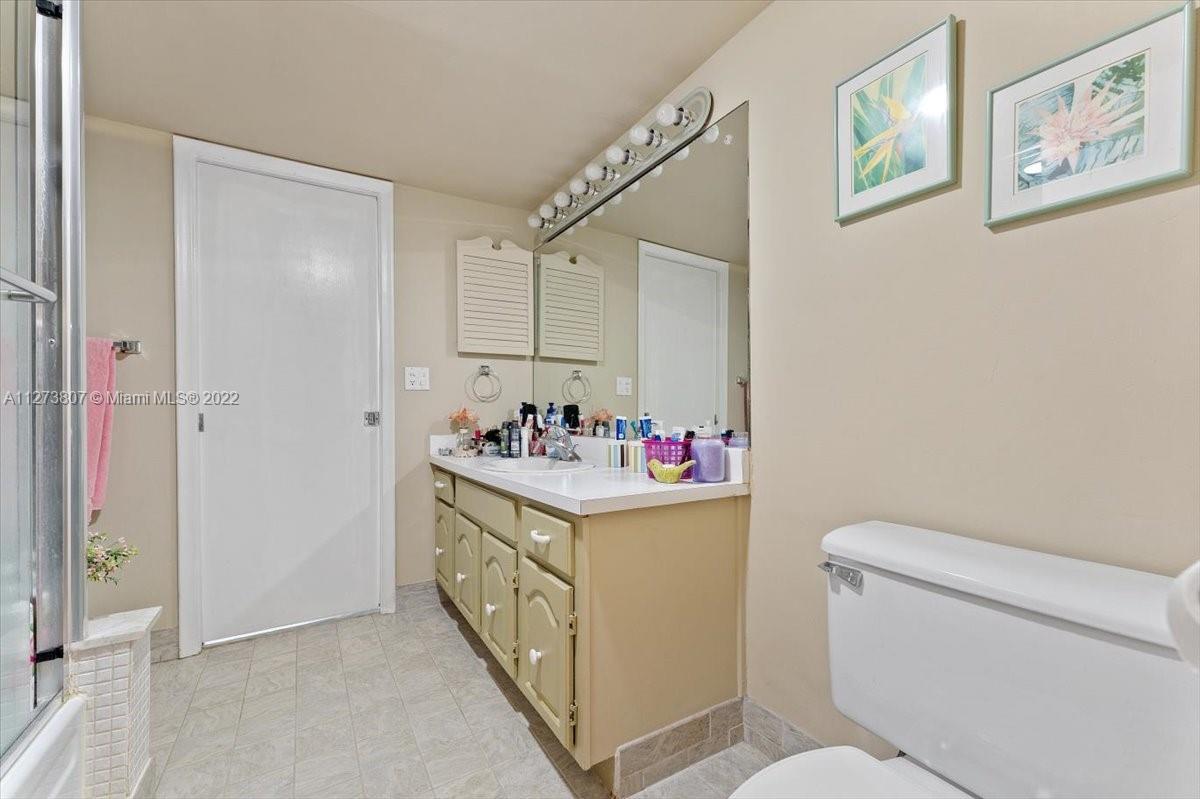 501 Southwest 11th Place, Unit 110 Boca Raton, FL 33432 - Photo 8 of 42 a utility room with dryer and washer