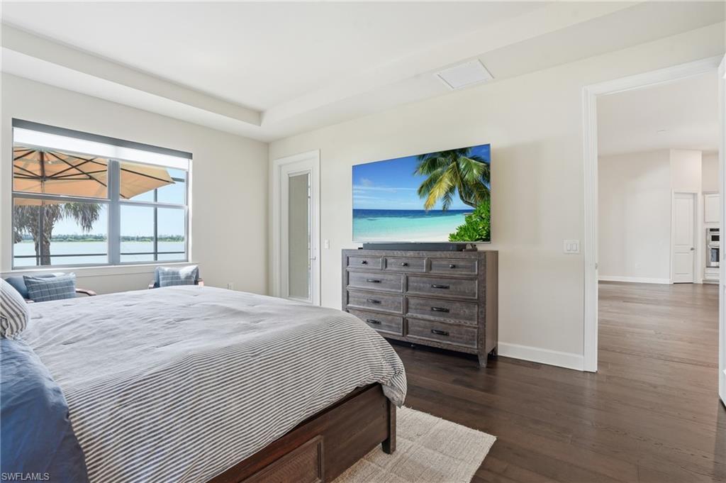 19696 Aqua View Lane Fort Myers, FL 33913 - Photo 17 of 50 a bedroom with a bed and a dresser