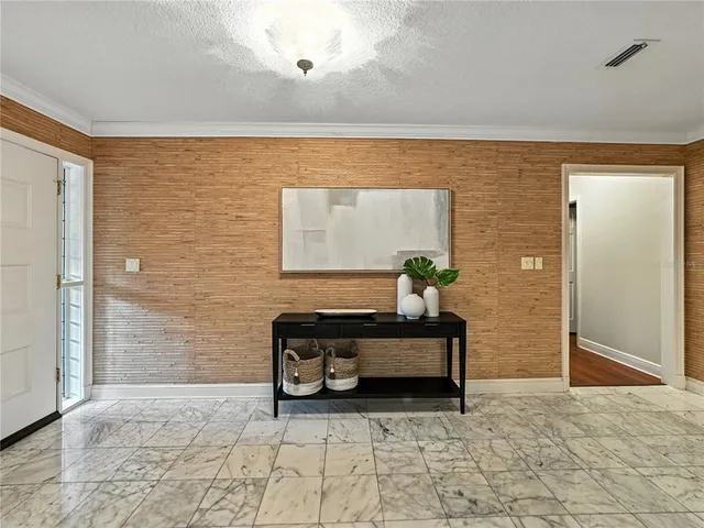 a living room with furniture a fireplace and a fireplace