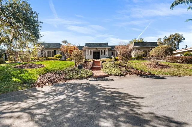 a kitchen with kitchen island a sink stainless steel appliances and cabinets