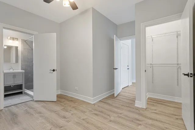 a view of a room with wooden floor sink and closet