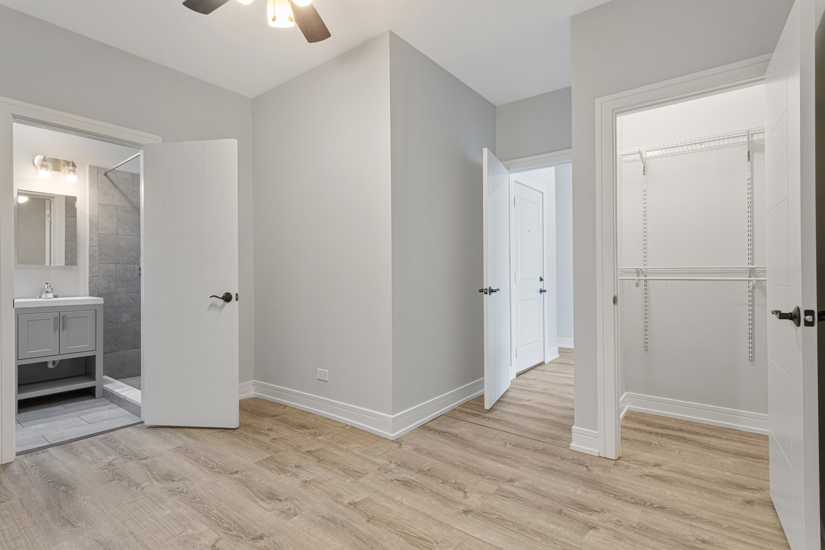 6942 North Wolcott Avenue, Unit 1 Chicago, IL 60626 - Photo 6 of 15 a view of a room with wooden floor sink and closet