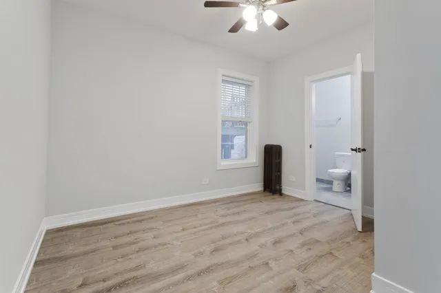 a view of an empty room with a bathroom