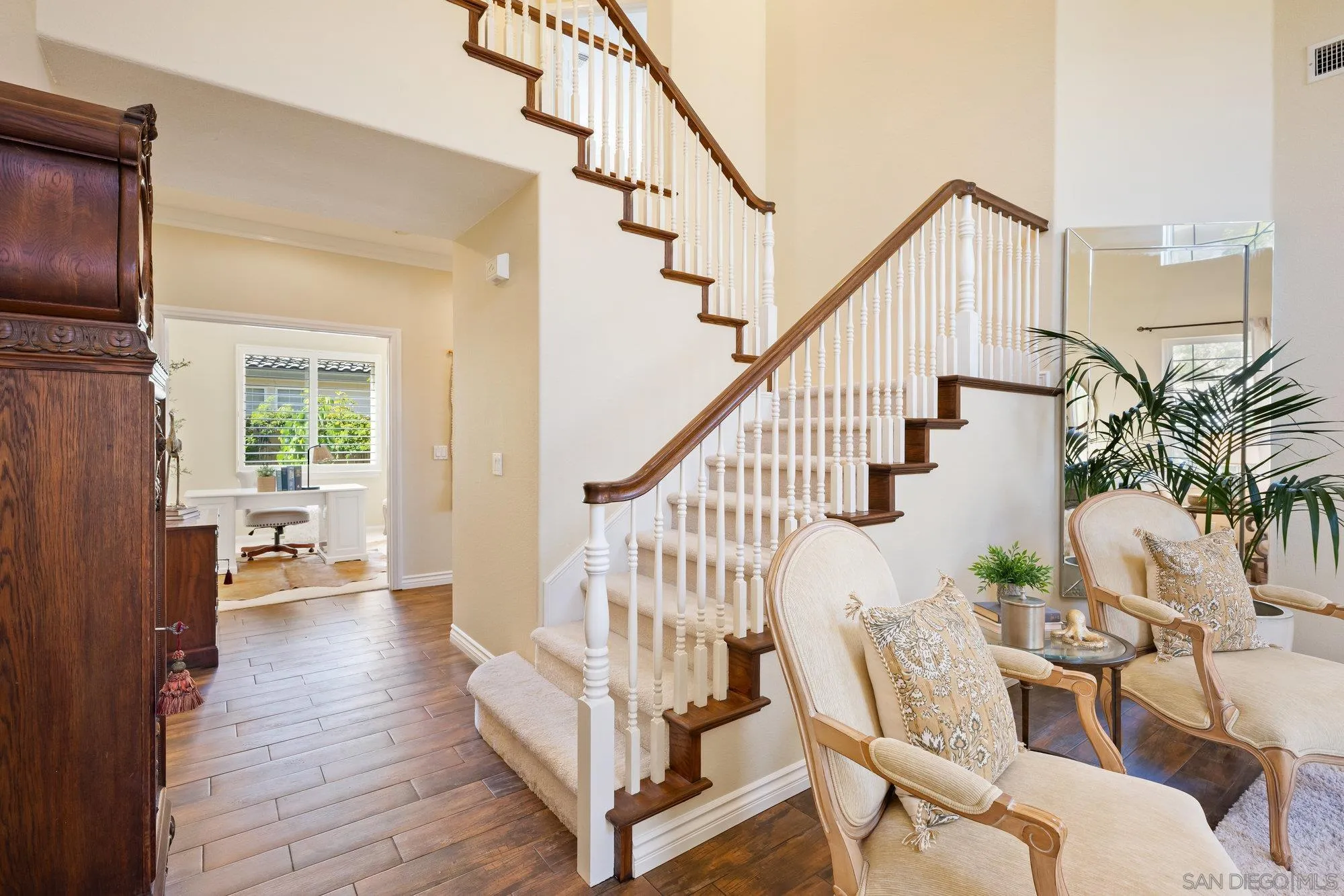 2822 Rancho Pancho Carlsbad, CA 92009 - Photo 11 of 26 a view of entryway with livingroom and wooden floor