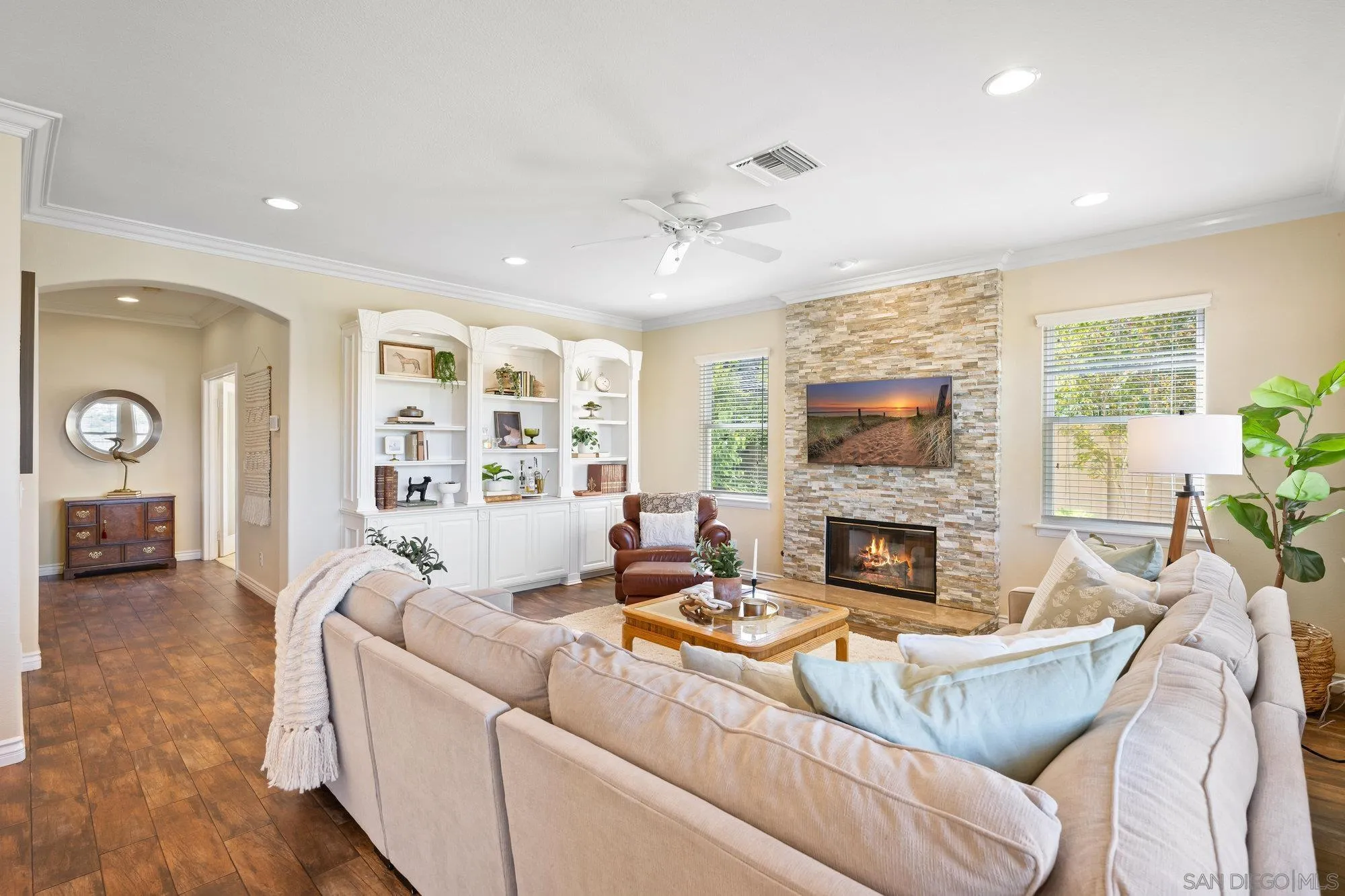 2822 Rancho Pancho Carlsbad, CA 92009 - Photo 2 of 26 a living room with furniture fireplace and a large window
