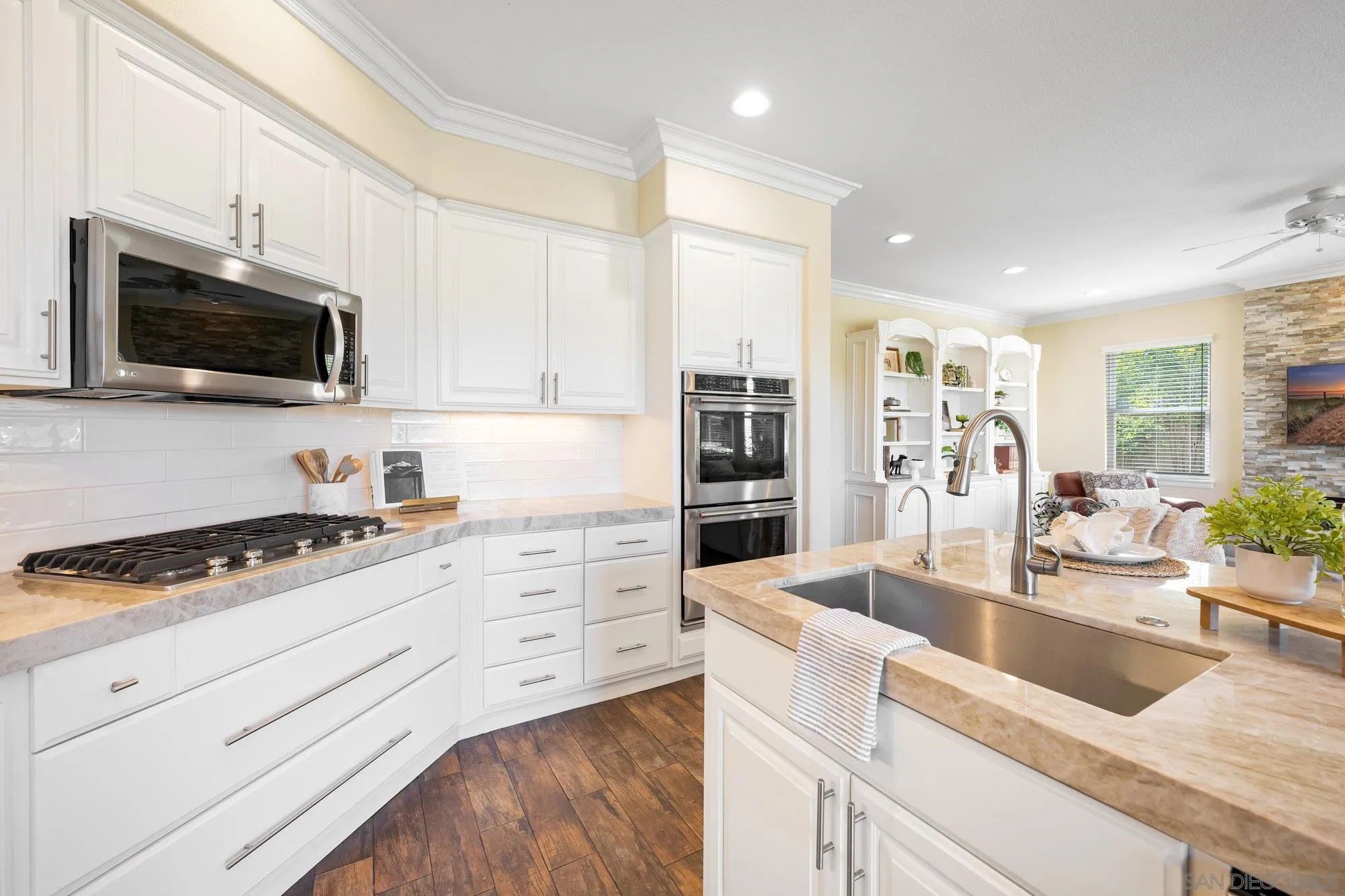 2822 Rancho Pancho Carlsbad, CA 92009 - Photo 10 of 26 a kitchen with granite countertop a sink a stove and cabinets