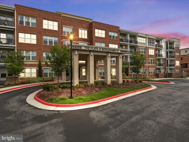 a swimming pool with outdoor seating and yard