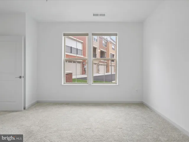 a bathroom with a double vanity sink mirror and shower